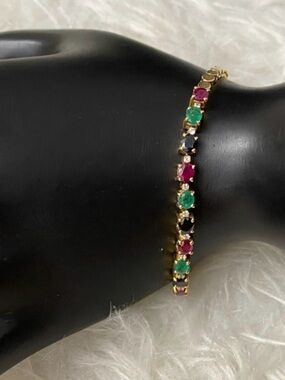Watch Video / 14K Gold Ruby, Emerald, Sapphire & Diamond Tennis Bracelet